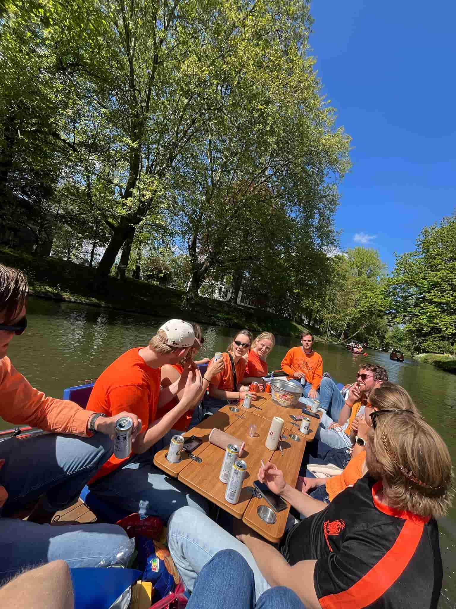 A happy group enjoying the view from the back of the boat
