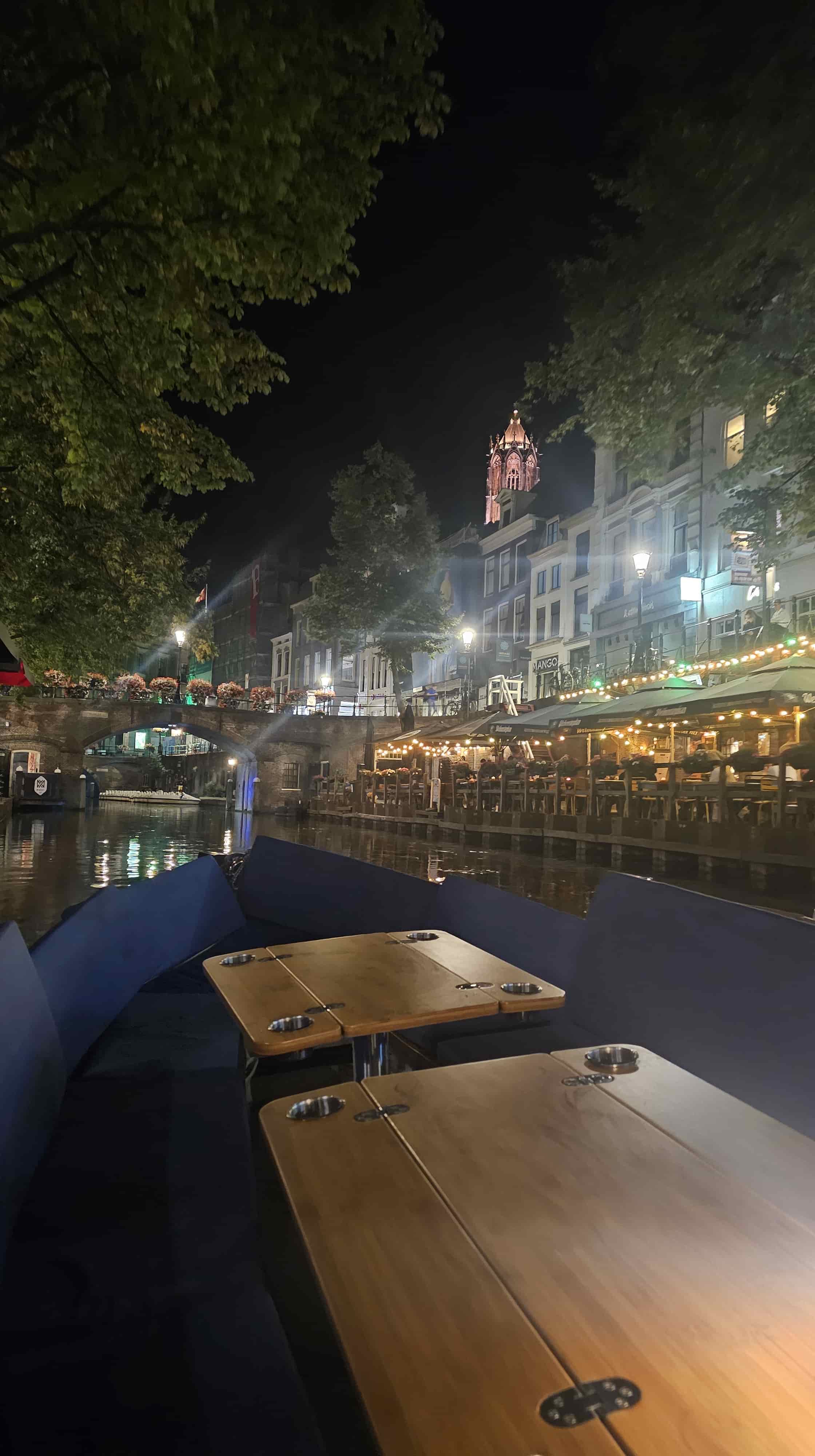 The boat cruising down a scenic Utrecht canal