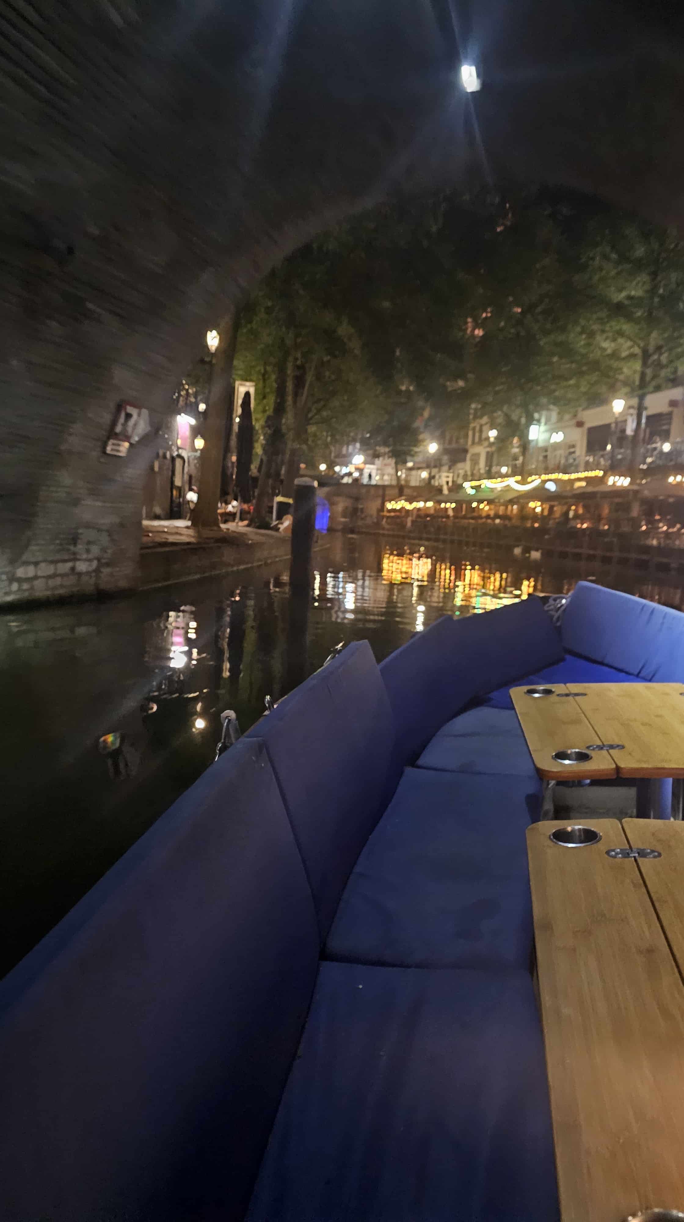 Passing through a historic, lit tunnel on the canal